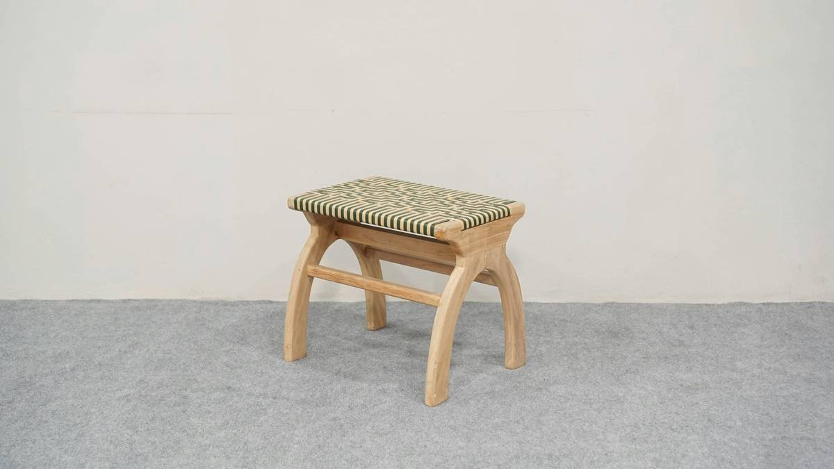 Side-by-side illustration: person slumped on decorative vanity stool vs. upright on ergonomic chair with labeled lumbar support, neutral spine, and proper elbow angle